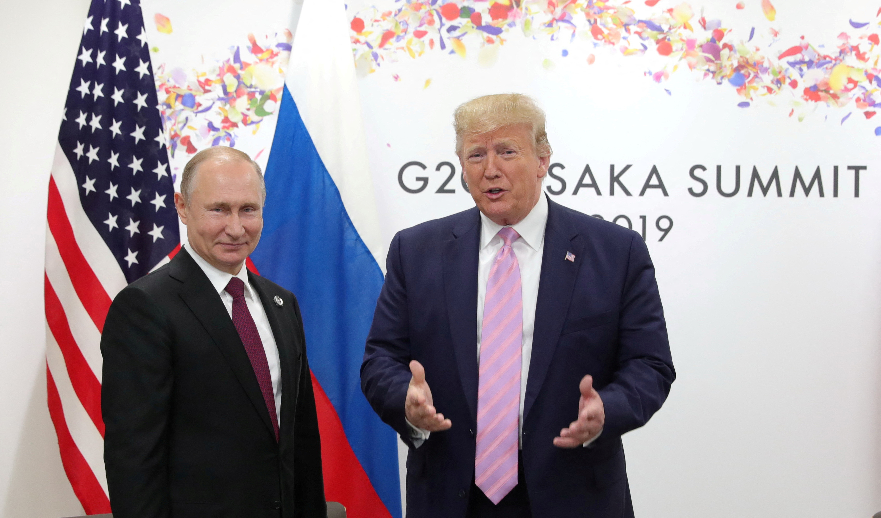 FILE PHOTO: Russia's President Vladimir Putin and U.S. President Donald Trump attend a meeting on the sidelines of the G20 summit in Osaka