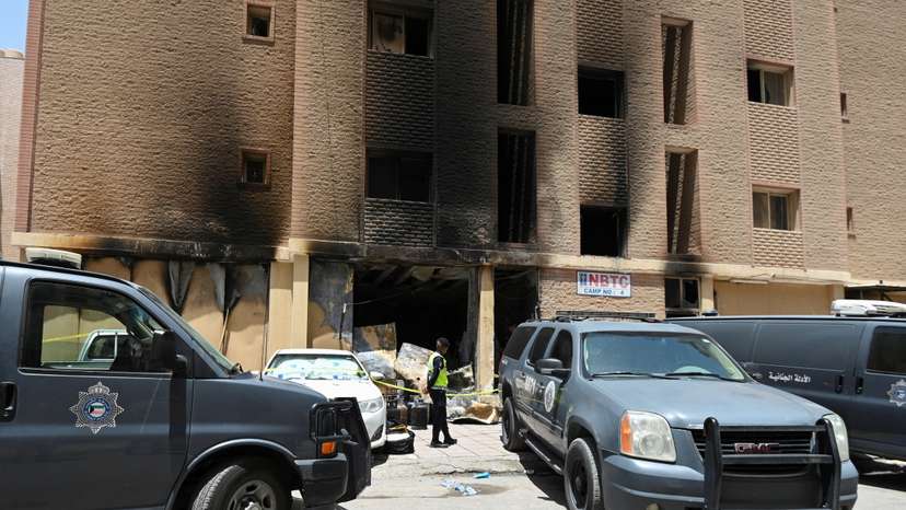 Aftermath of a deadly fire in a building, in Mangaf