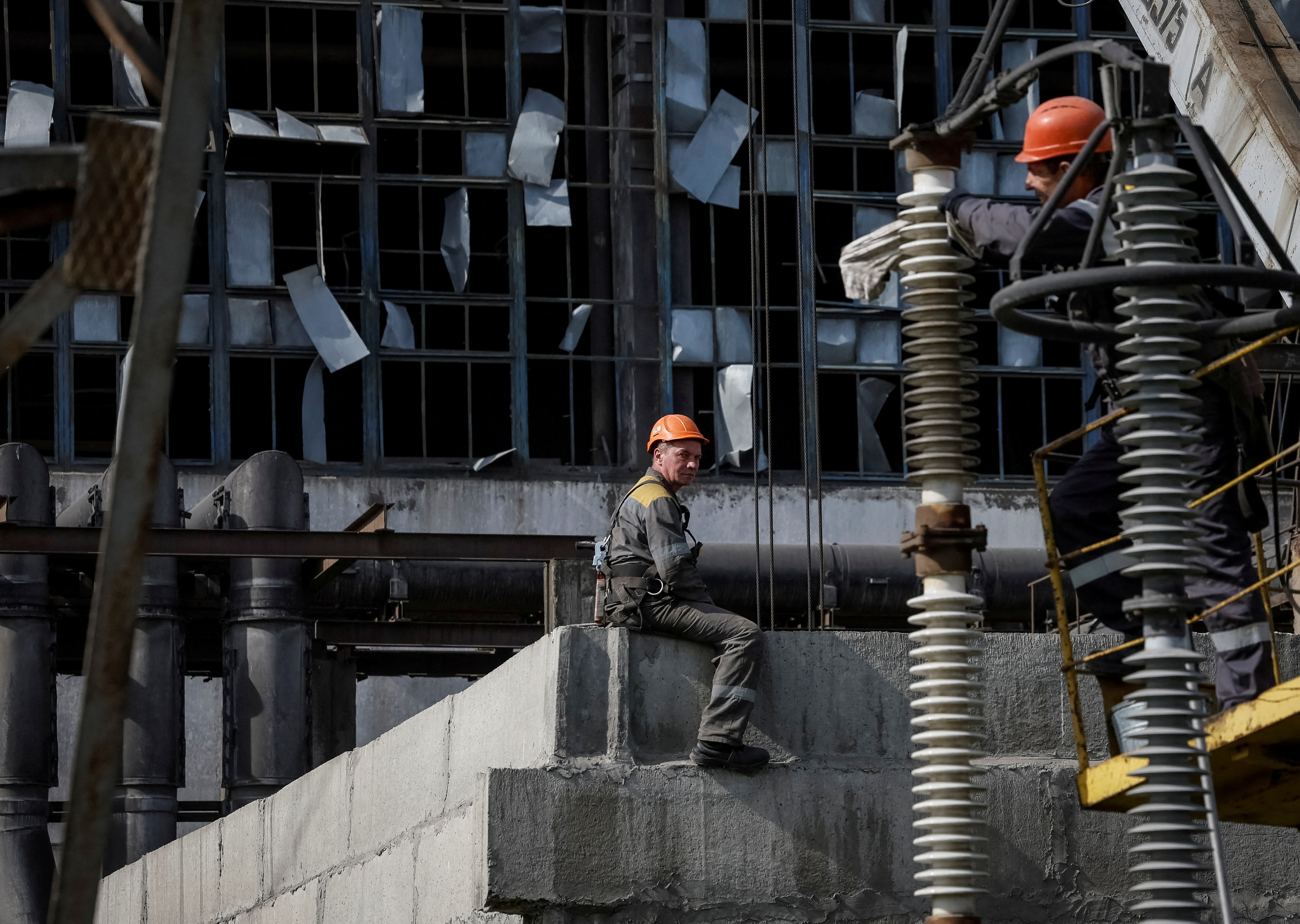 FILE PHOTO: People work at a thermal power plant damaged by recent Russian missile strike