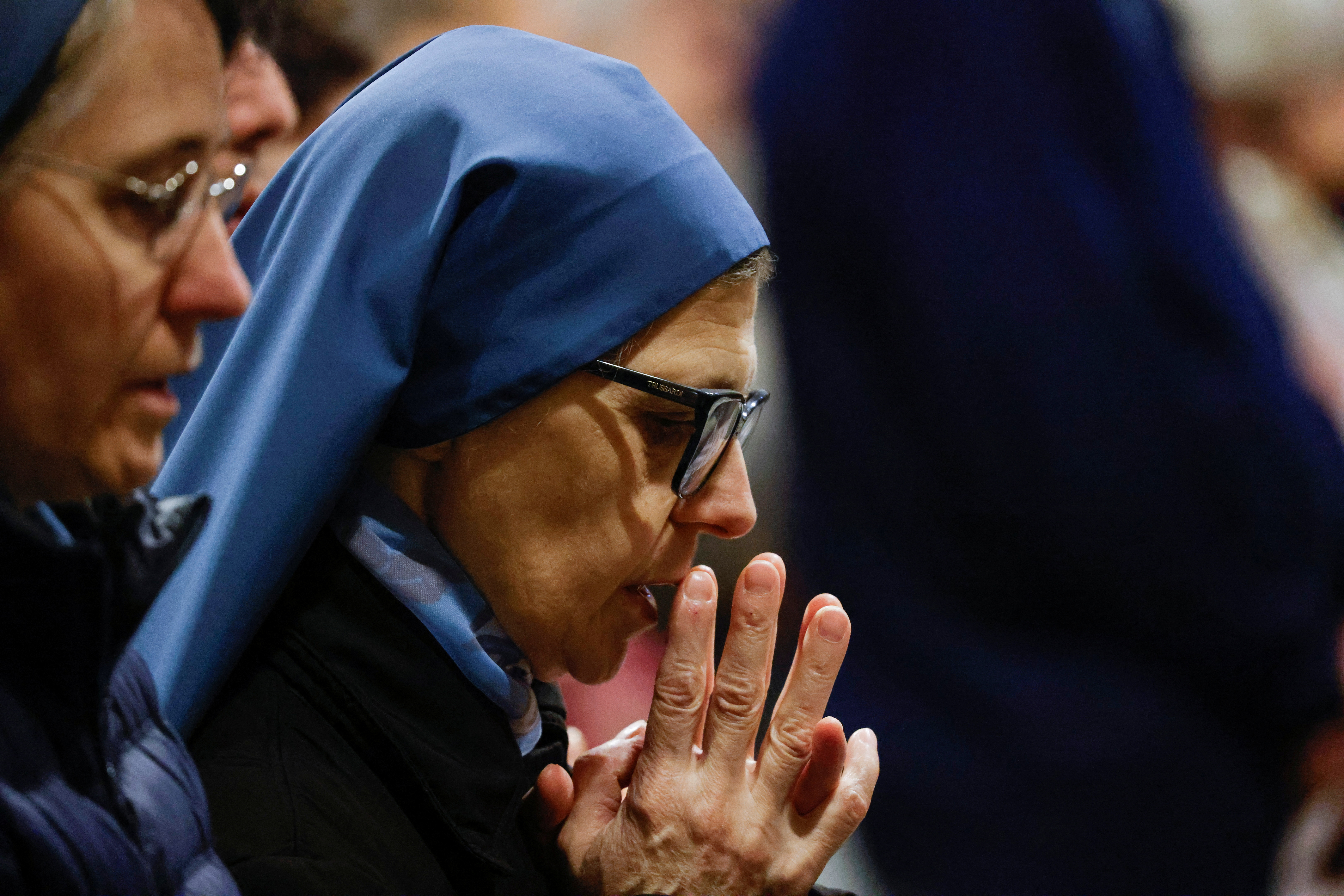 People pray for Pope Francis' recovery in St. Peter's Basilica at the Vatican