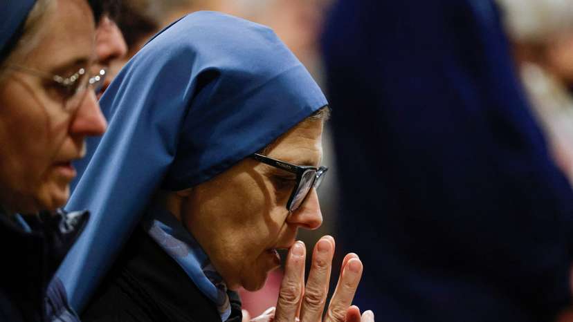 People pray for Pope Francis' recovery in St. Peter's Basilica at the Vatican