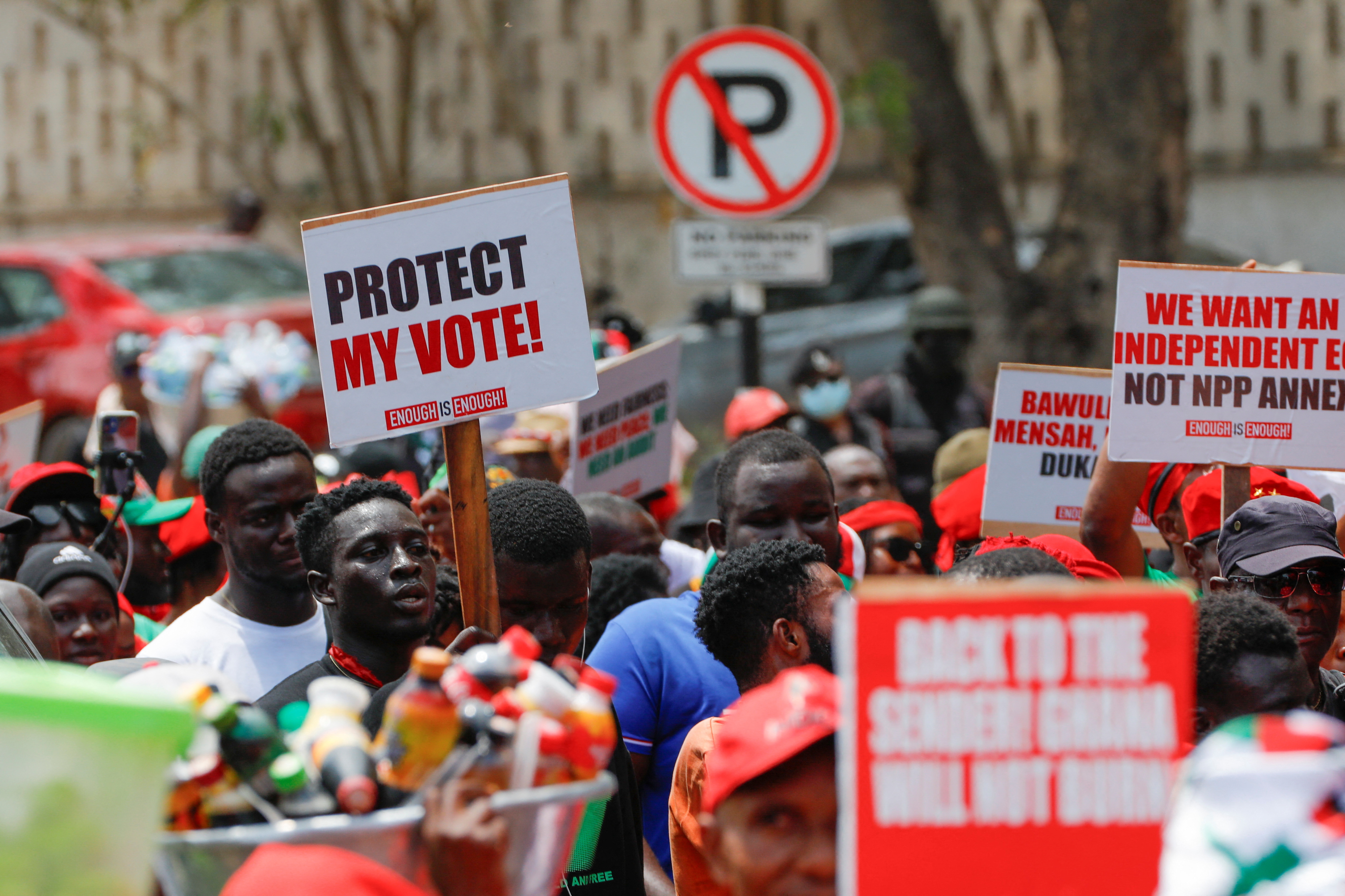 Supporters of Ghana's main NDC party protest what they suspect to be voter roll irregularities, in Accra