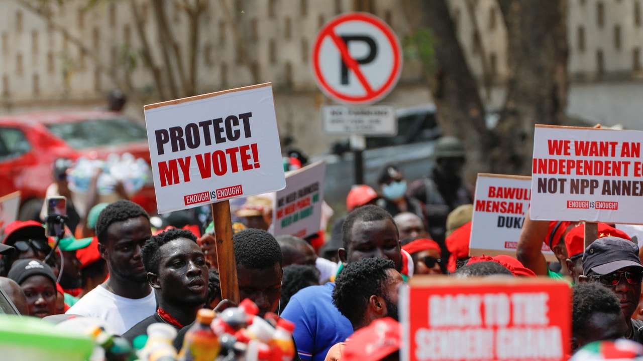 Supporters of Ghana's main NDC party protest what they suspect to be voter roll irregularities, in Accra