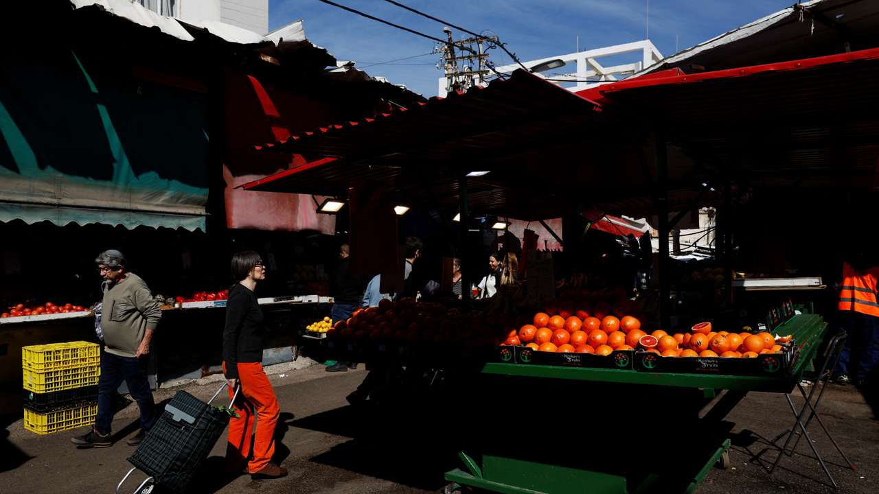 People shop at Carmel Market (Shuk Hacarmel) amid the ongoing conflict between Israel and Hamas, in Tel Aviv