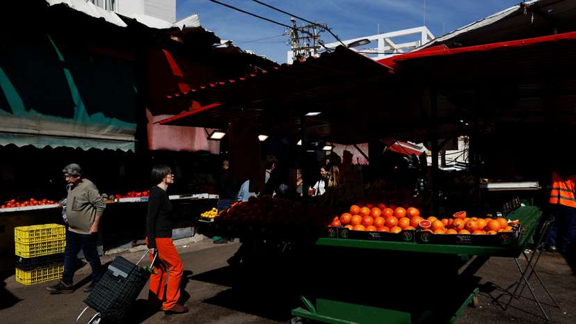 People shop at Carmel Market (Shuk Hacarmel) amid the ongoing conflict between Israel and Hamas, in Tel Aviv
