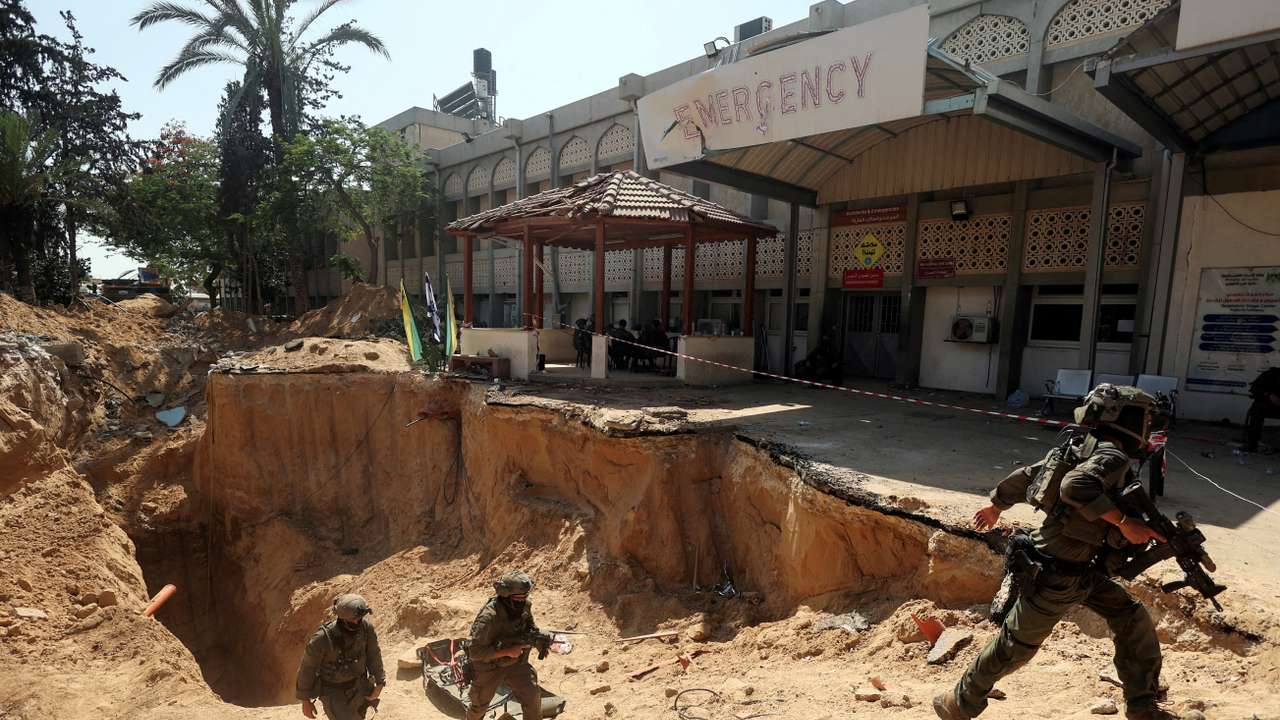 FILE PHOTO: Israeli soldiers walk out from a tunnel underneath the European Hospital in Khan Younis at the Gaza Strip