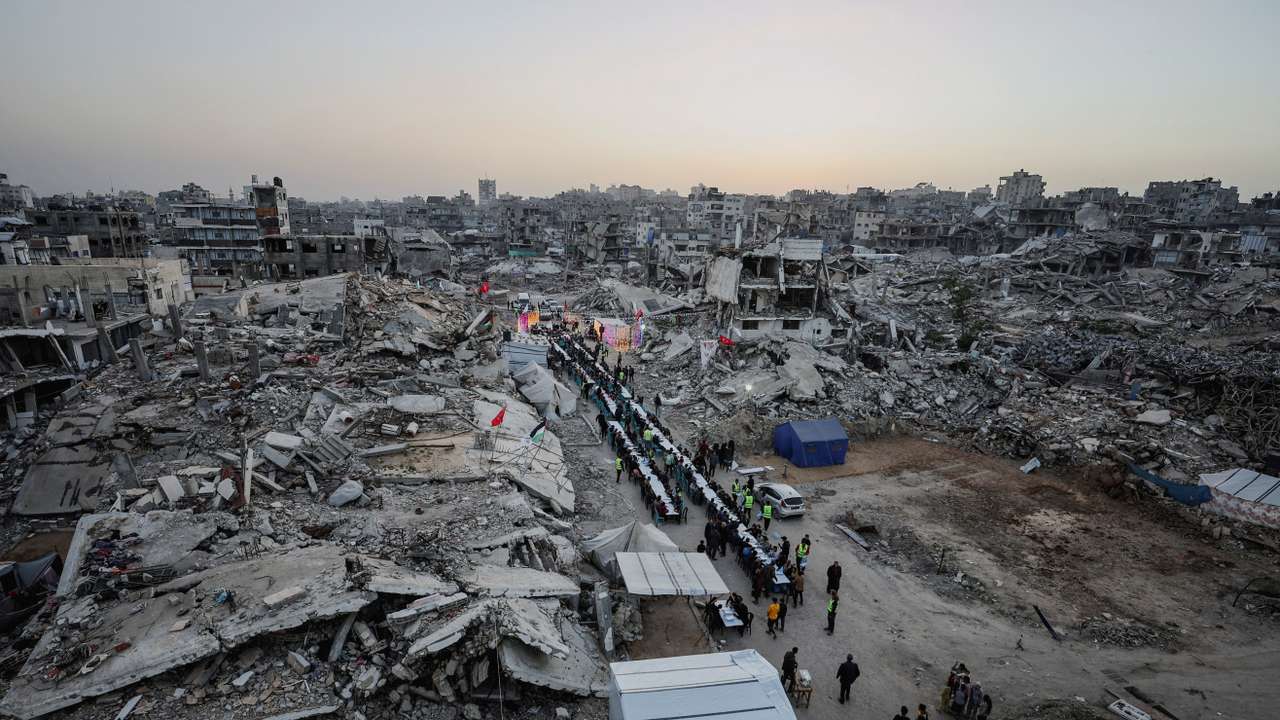Palestinians gather to break their fast by eating Iftar meals on the first day of the holy month of Ramadan, in Gaza City