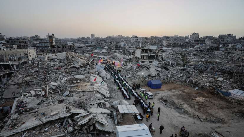 Palestinians gather to break their fast by eating Iftar meals on the first day of the holy month of Ramadan, in Gaza City