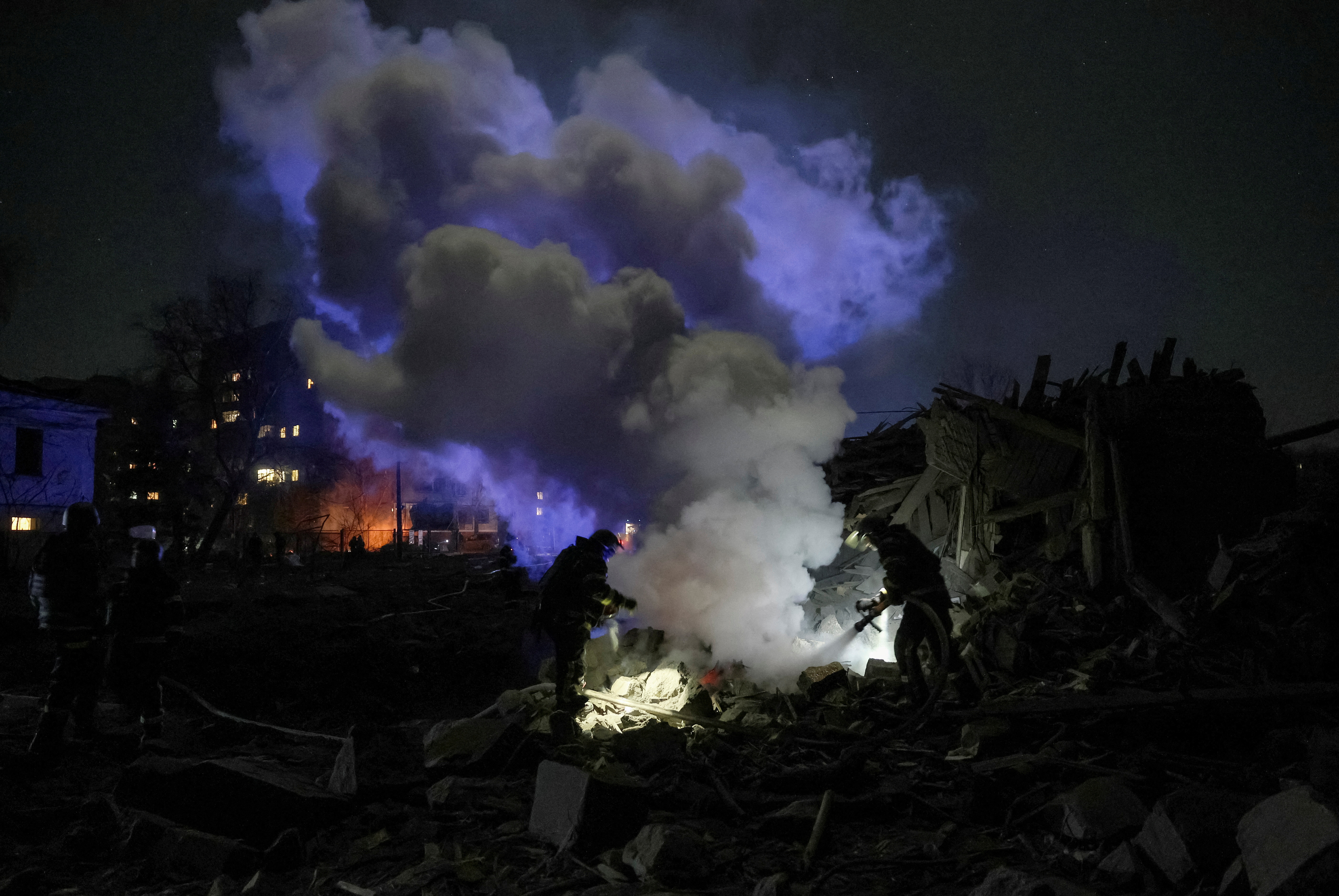 Firefighters work at a site of a Russian missile strike in the town of Kramatorsk