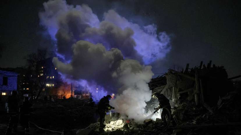 Firefighters work at a site of a Russian missile strike in the town of Kramatorsk