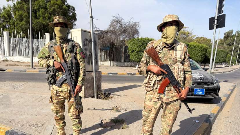 Members of the 444 Brigade of the Libyan Army stand guard at Abu Salim area in Tripoli