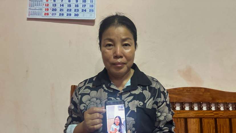 Bunyarin Srijan, the mother of a Thai hostage released as part of a hostages-prisoners swap deal between Hamas and Israel, holds her phone showing an image of her daughter, Natthawaree Mulkan, during an interview at her home in Khon Kaen