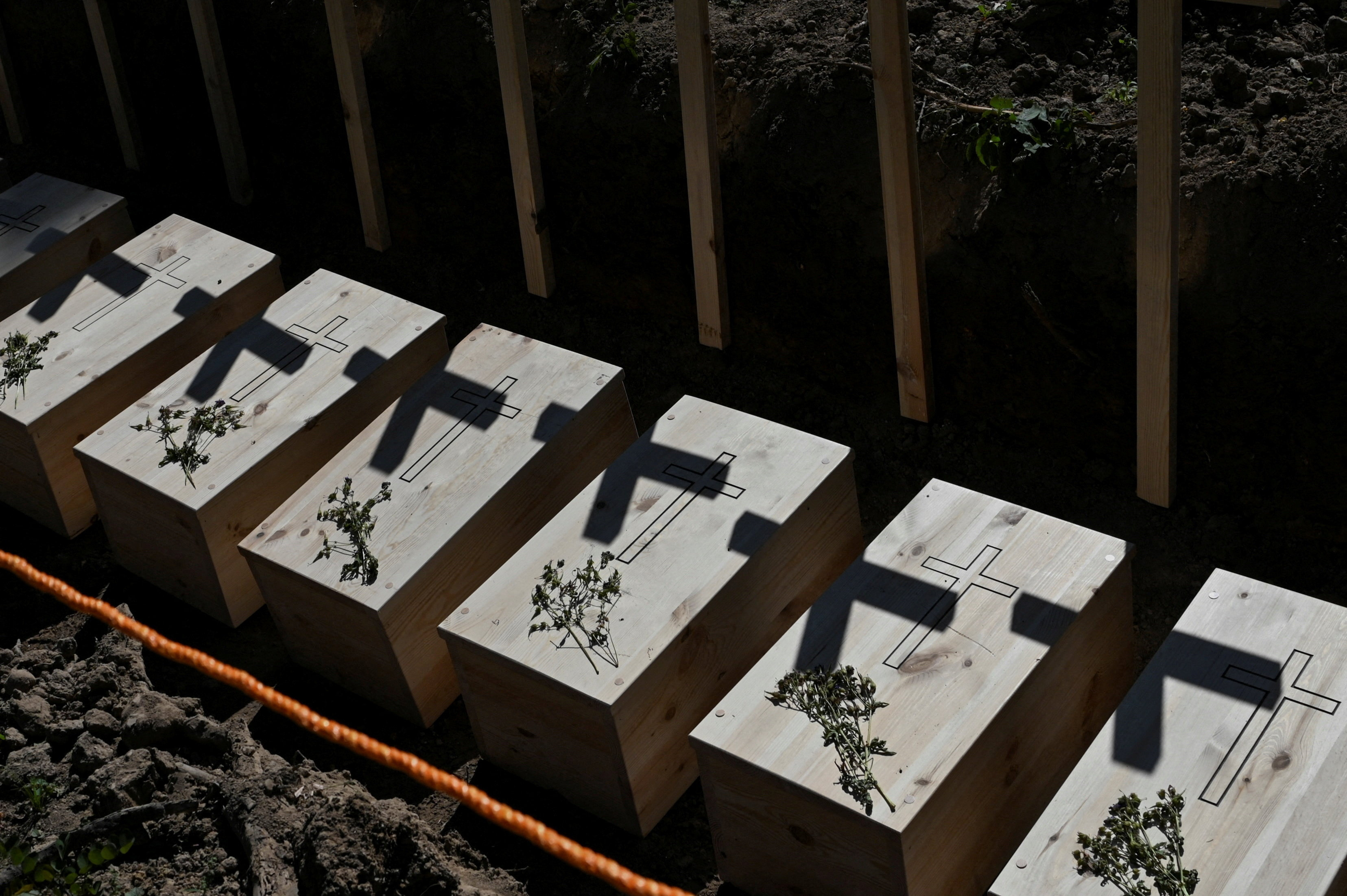 Mass burial of, previously exhumated, Poles killed by Ukrainian nationalists during World War II, in the former village of Puzhnyky