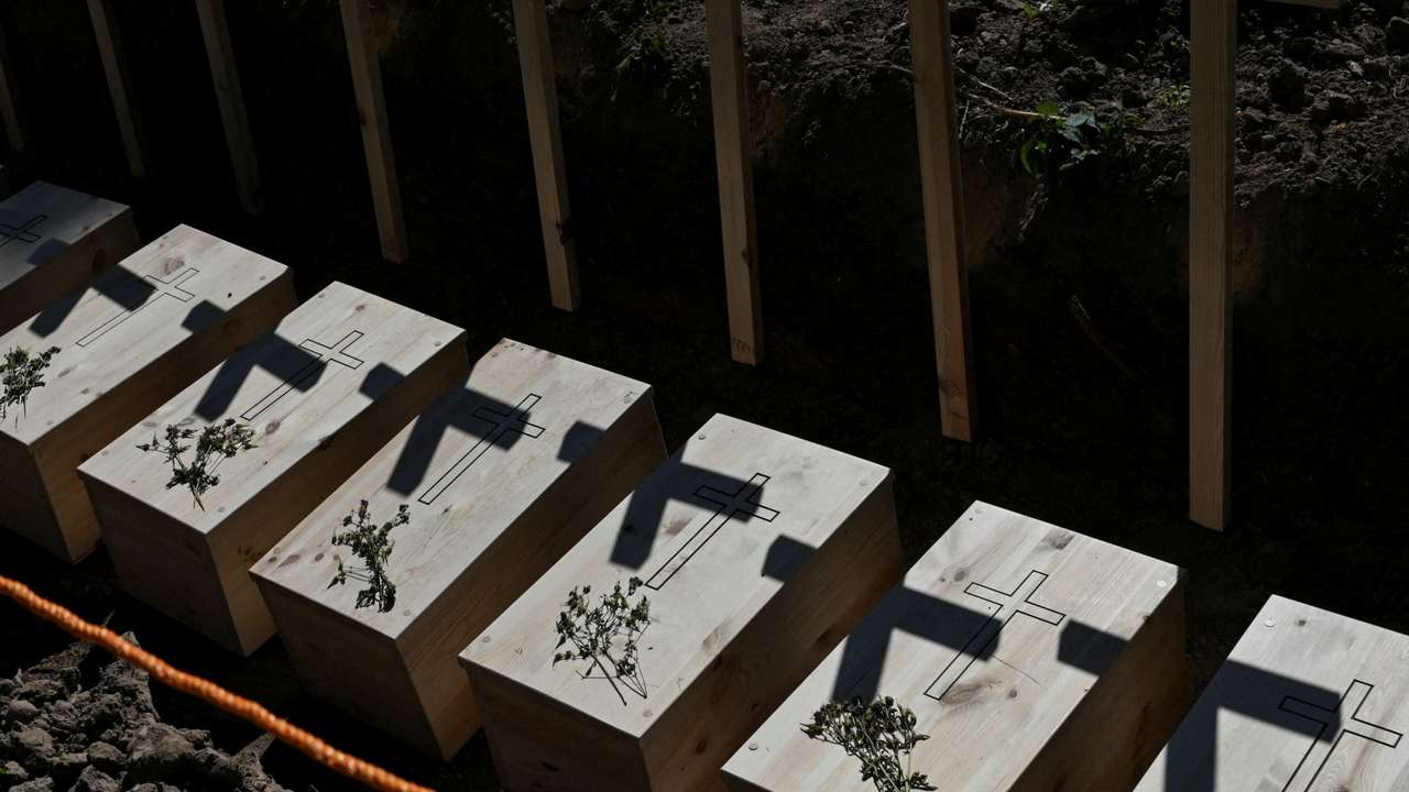 Mass burial of, previously exhumated, Poles killed by Ukrainian nationalists during World War II, in the former village of Puzhnyky