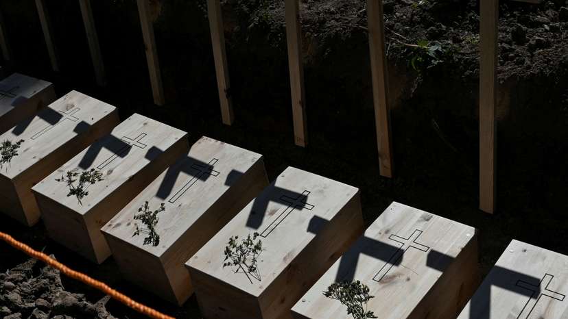 Mass burial of, previously exhumated, Poles killed by Ukrainian nationalists during World War II, in the former village of Puzhnyky