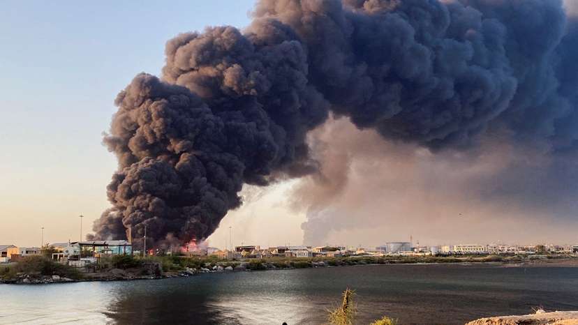 A view shows a large plume of smoke rising from fuel depot in Port Sudan