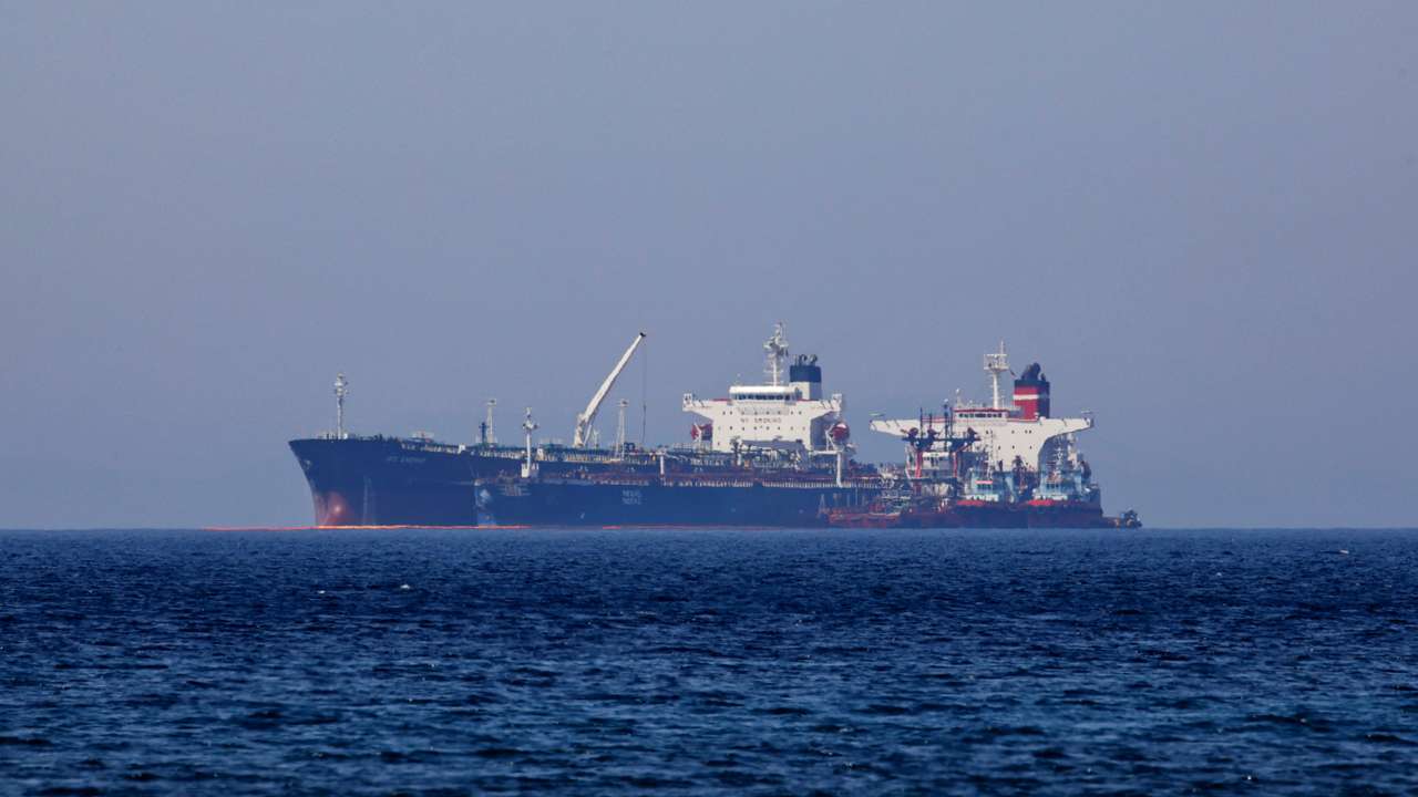 FILE PHOTO: The Liberian-flagged oil tanker Ice Energy transfers crude oil from the Iranian-flagged oil tanker Lana off the shore of Karystos