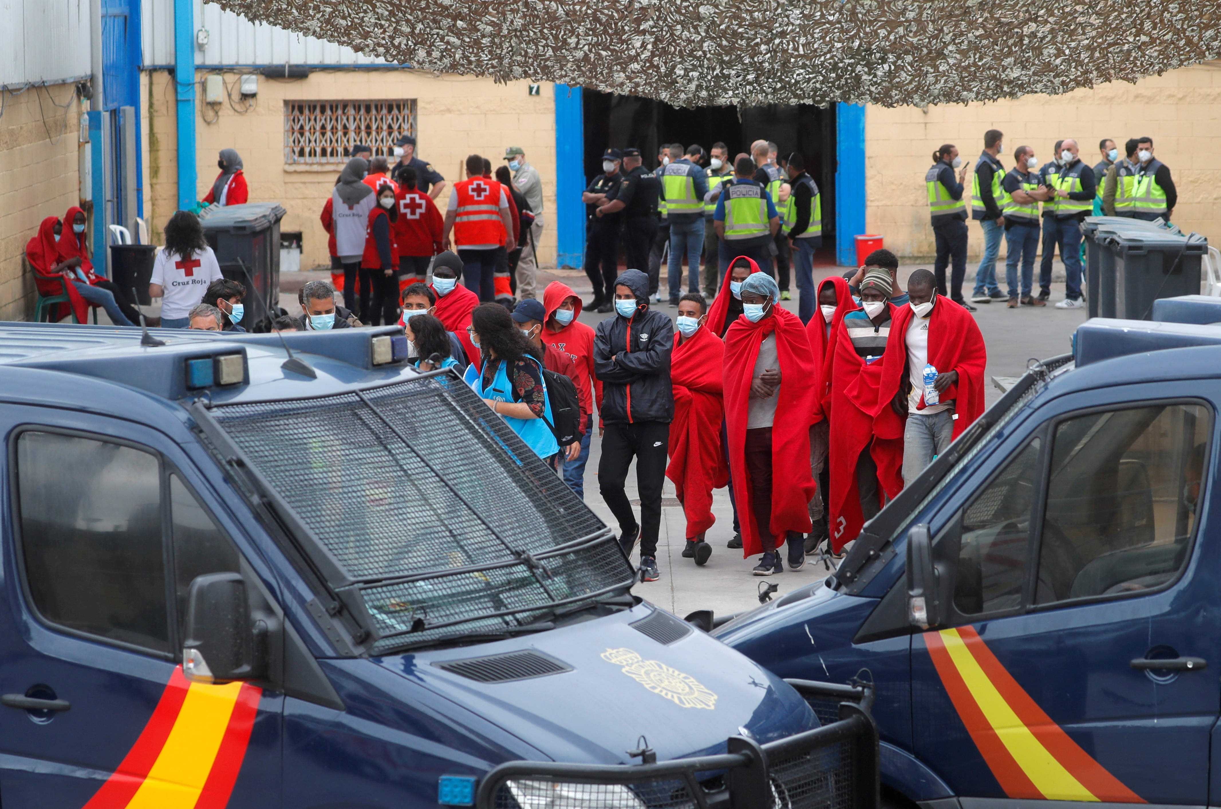 FILE PHOTO: Thousands of migrants cross the Spanish-Moroccan border in Ceuta