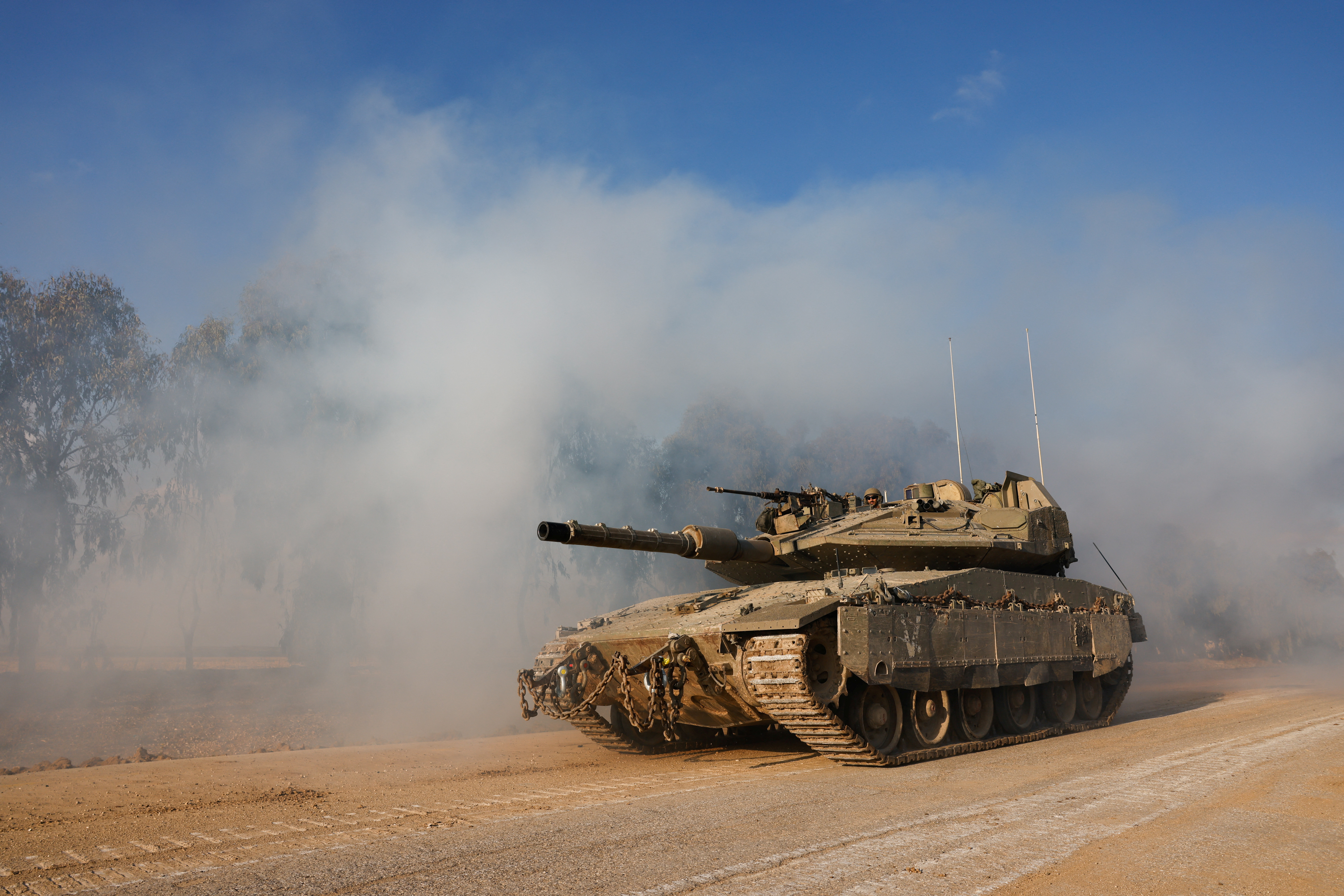 An Israeli tank manoeuvres near the Israel-Gaza border