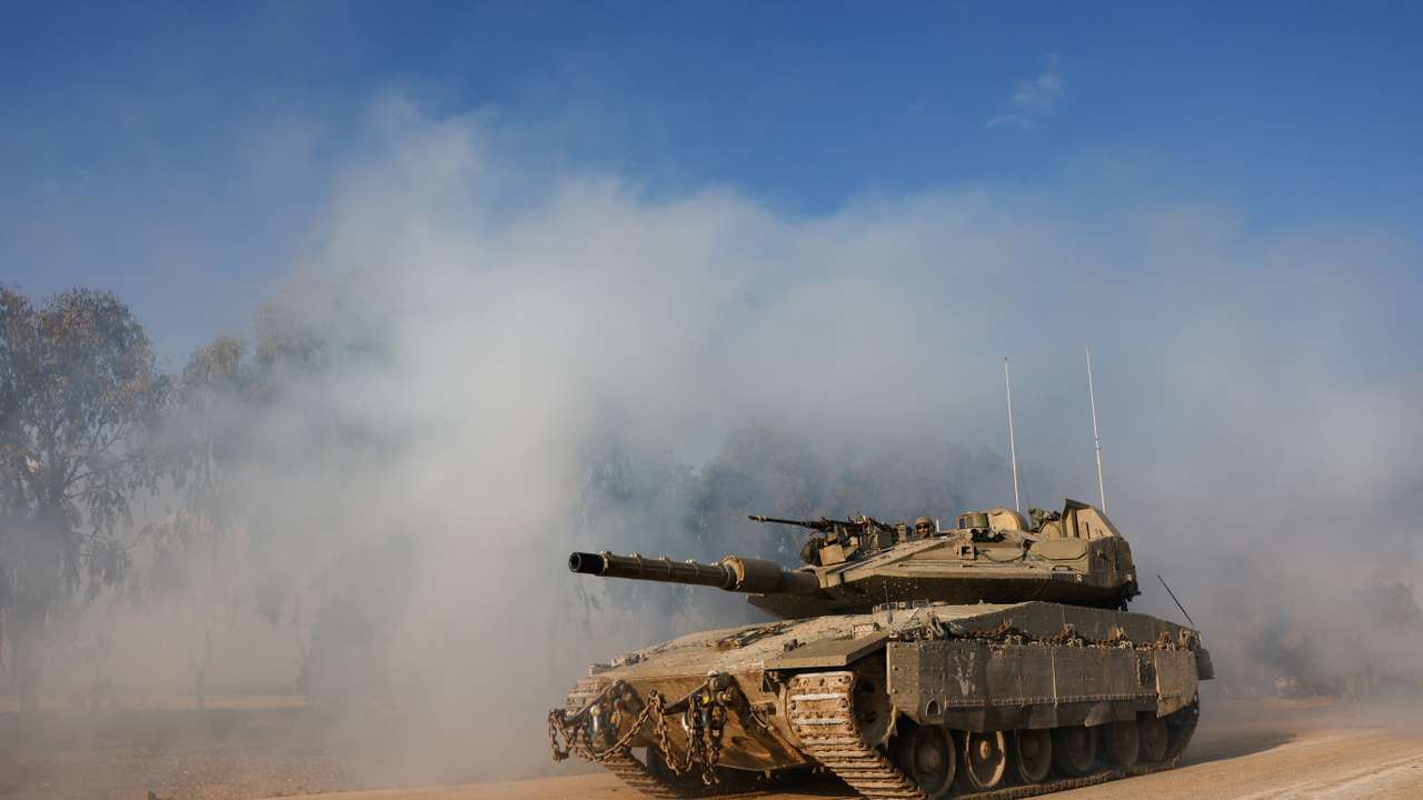 An Israeli tank manoeuvres near the Israel-Gaza border