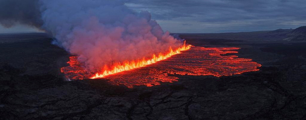 Lava emerges through a fissure following a volcano eruption near Grindavik