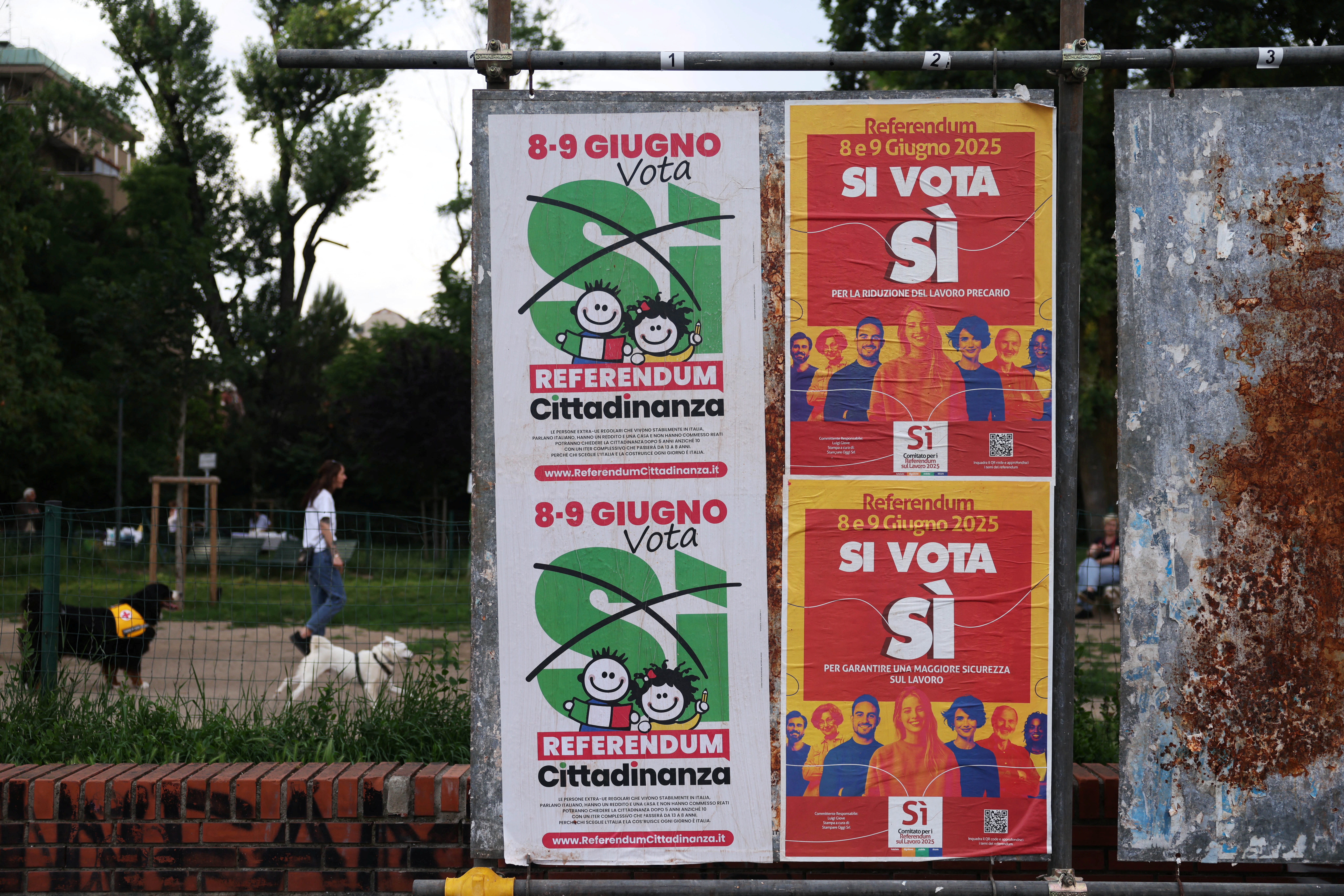 A view shows banners in favour of five abrogative referendum that will take place on jobs and Italian citizenship in Milan