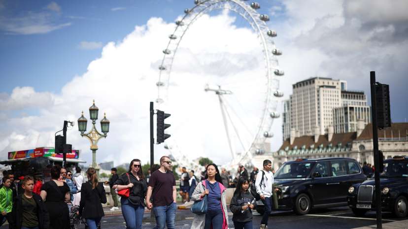 People walk over Westminster Bridge in London