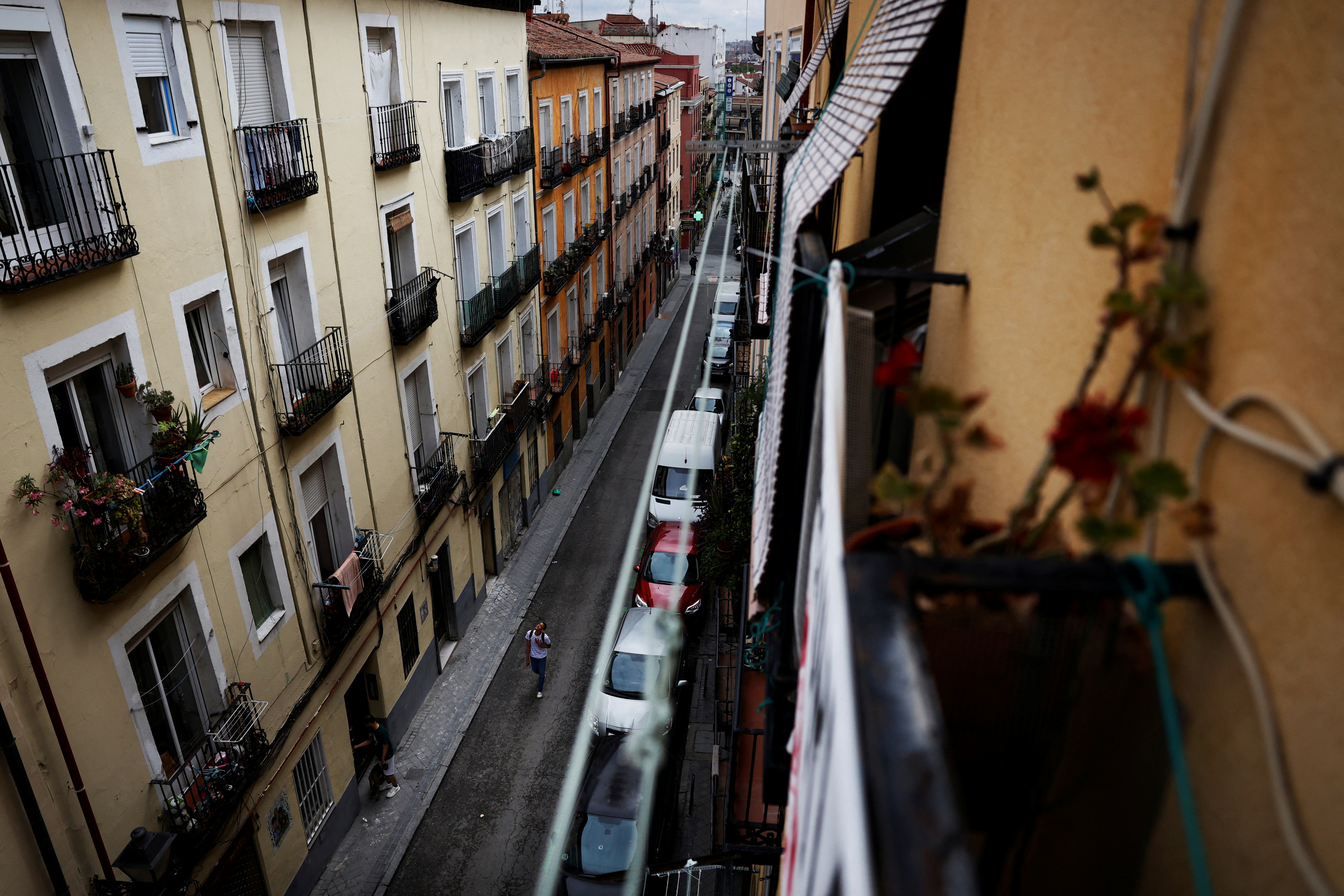 A person walks on the street of Cajamarca's rented flat in Madrid