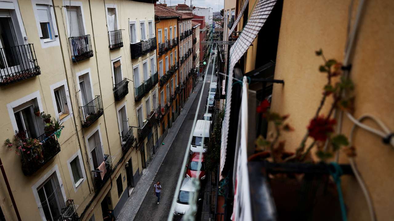 A person walks on the street of Cajamarca's rented flat in Madrid