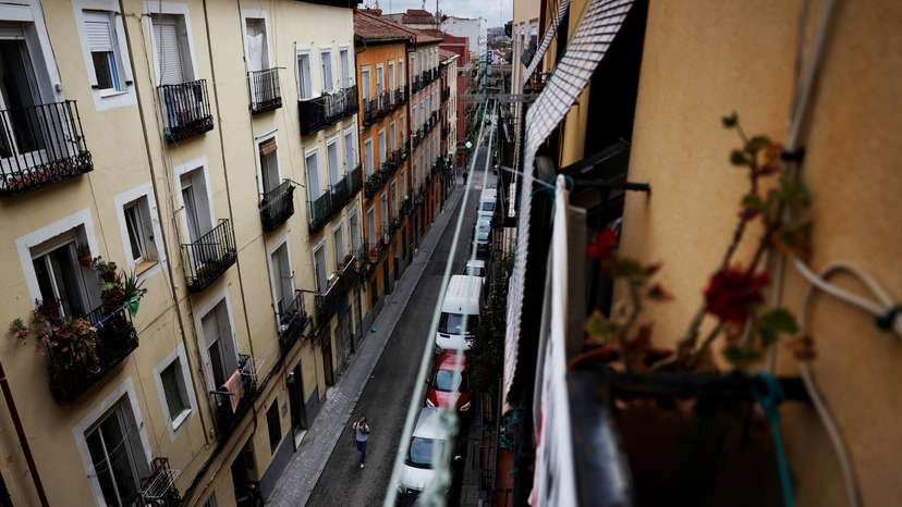 A person walks on the street of Cajamarca's rented flat in Madrid