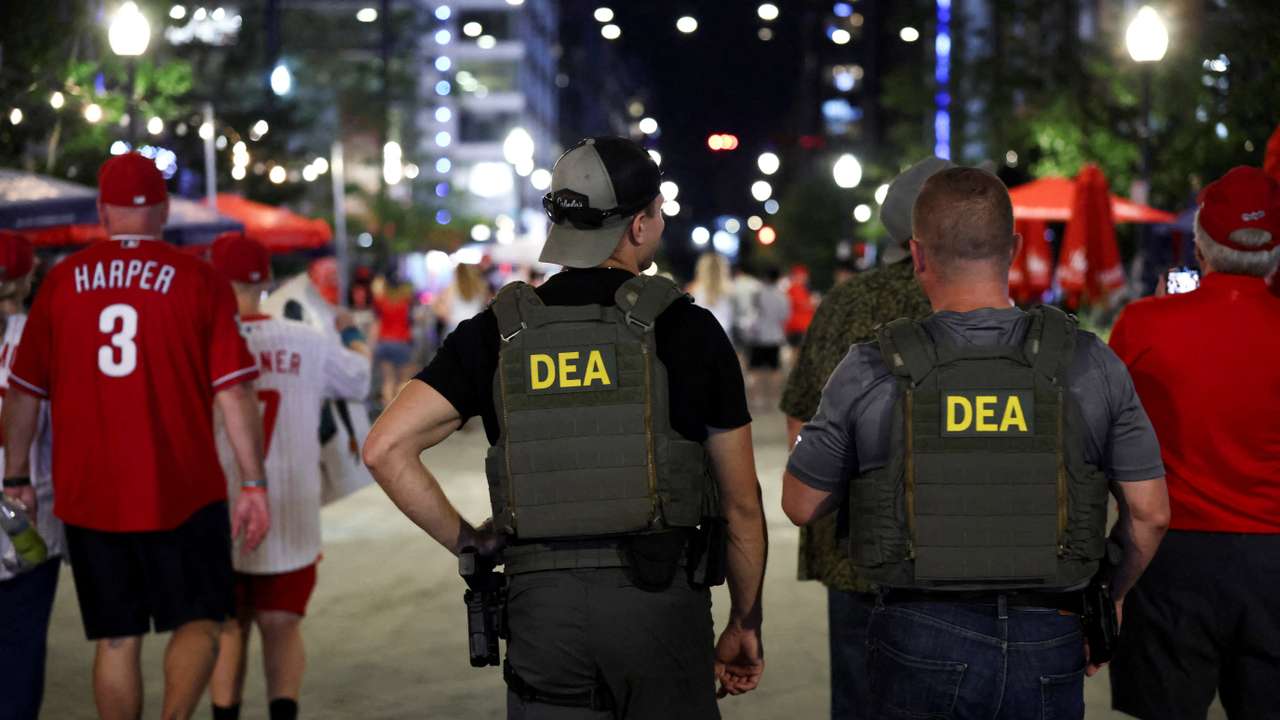 FILE PHOTO: Drug Enforcement Administration (DEA) federal agents patrol outside Nationals Park as fans leave  after a baseball game at the Navy Yard, after U.S. President Donald Trump's announcement of the federal takeover of the Metropolitan Police Department under the Home Rule Act and the deployment of the National Guard to assist in crime prevention in the nation's capital, in Washington, D.C., U.S., August 14, 2025. REUTERS/Evelyn Hockstein/File Photo