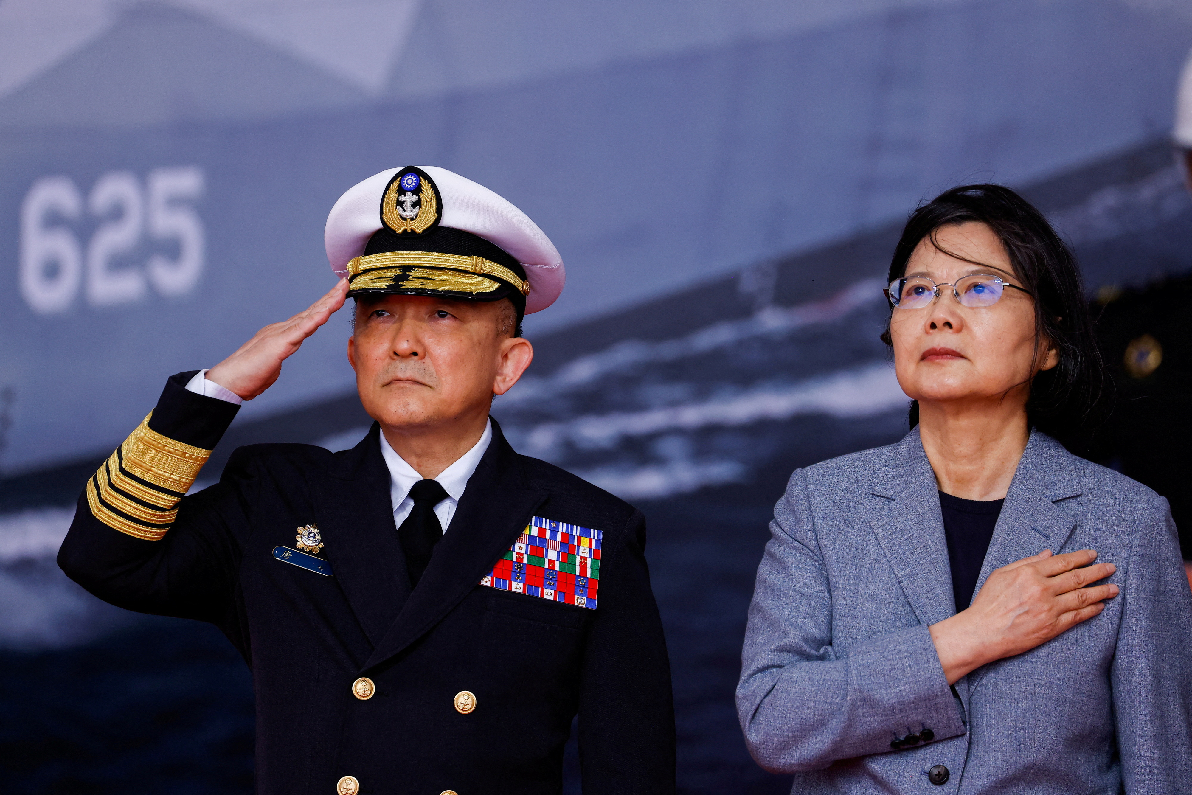 FILE PHOTO: Taiwan President Tsai Ing-wen and Taiwan Navy Commander Tang Hua attend the delivery ceremony of six made-in-Taiwan Tuo Chiang-class corvettes at a port in Yilan