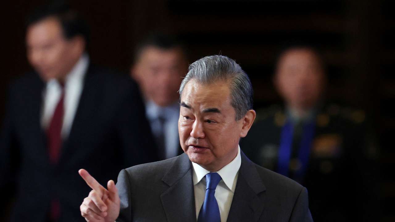 FILE PHOTO: Chinese Foreign Minister Wang Yi speaks at a seminar in Beijing