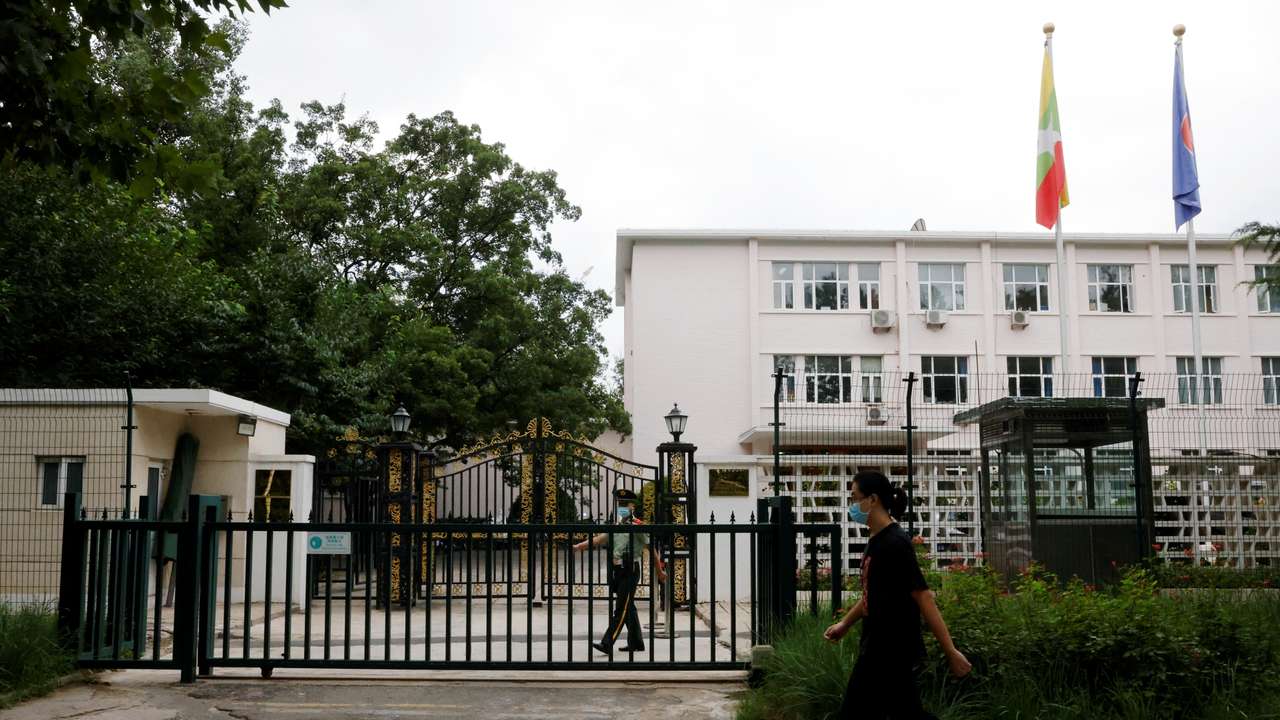 Man walks past the Myanmar embassy in Beijing