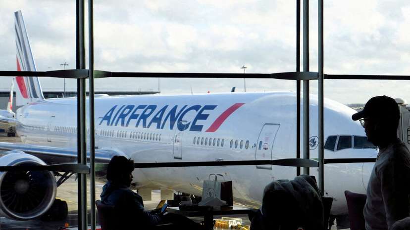 Passengers wait for an Air-France flight inside the Terminal 2 at Paris Charles de Gaulle airport in Roissy-en-France near Paris, France,