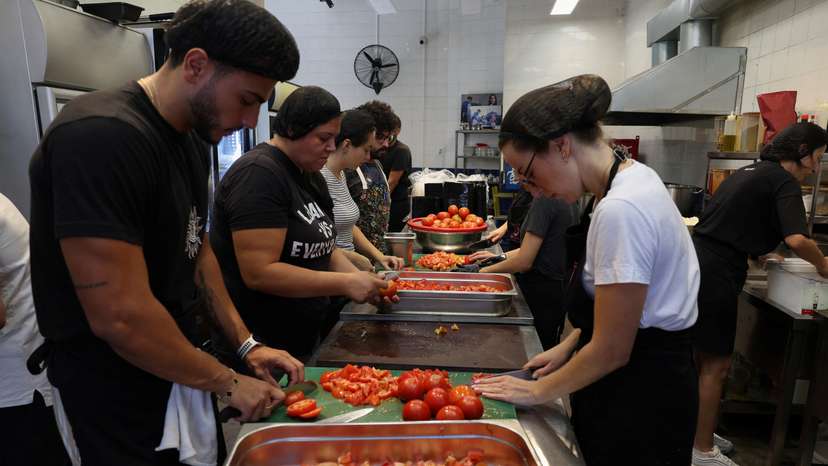 Volunteers prepare meals to be distributed for displaced people, in Beirut