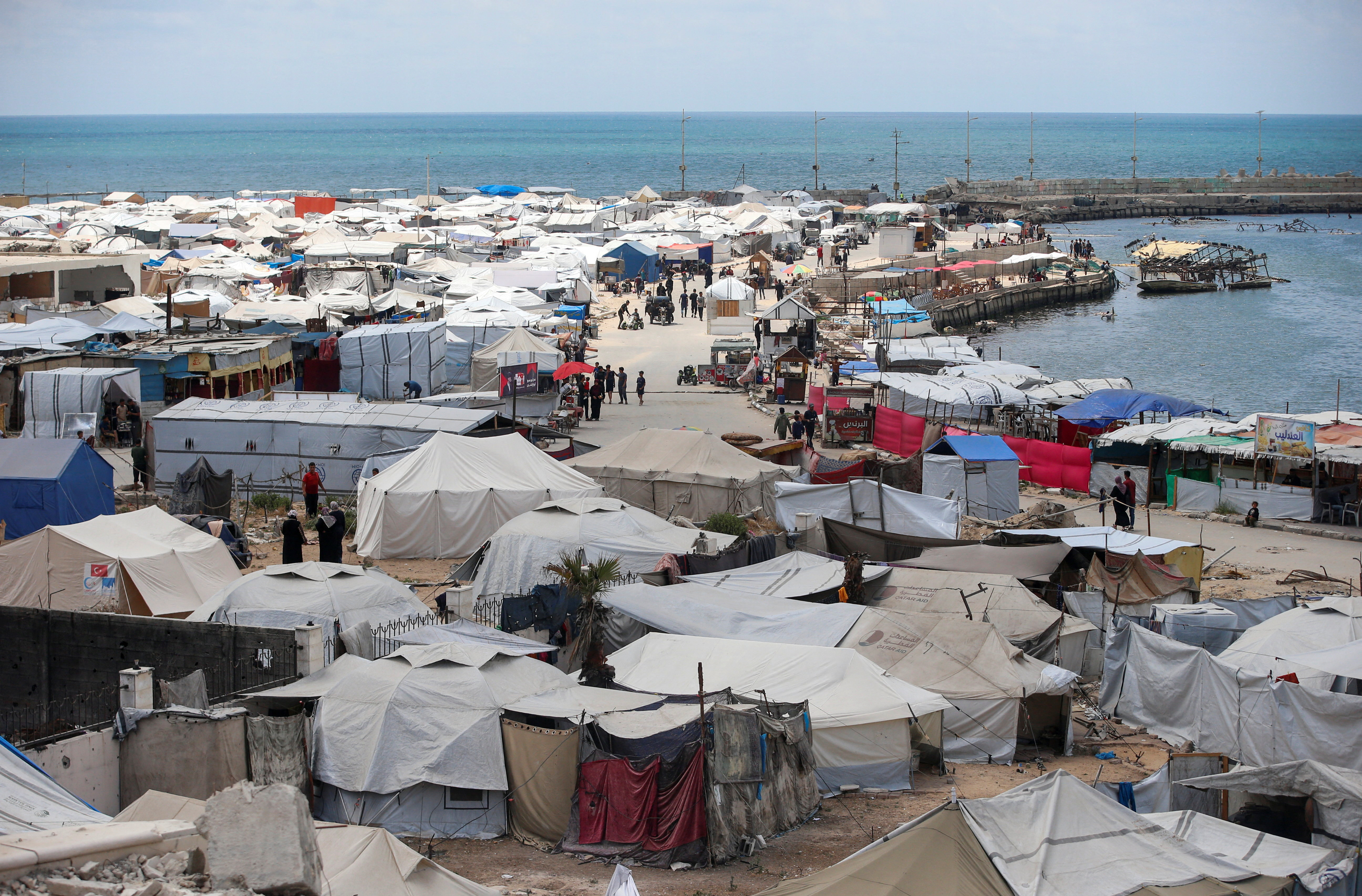 Palestinians displaced by the Israeli military offensive shelter in tents, in Gaza City