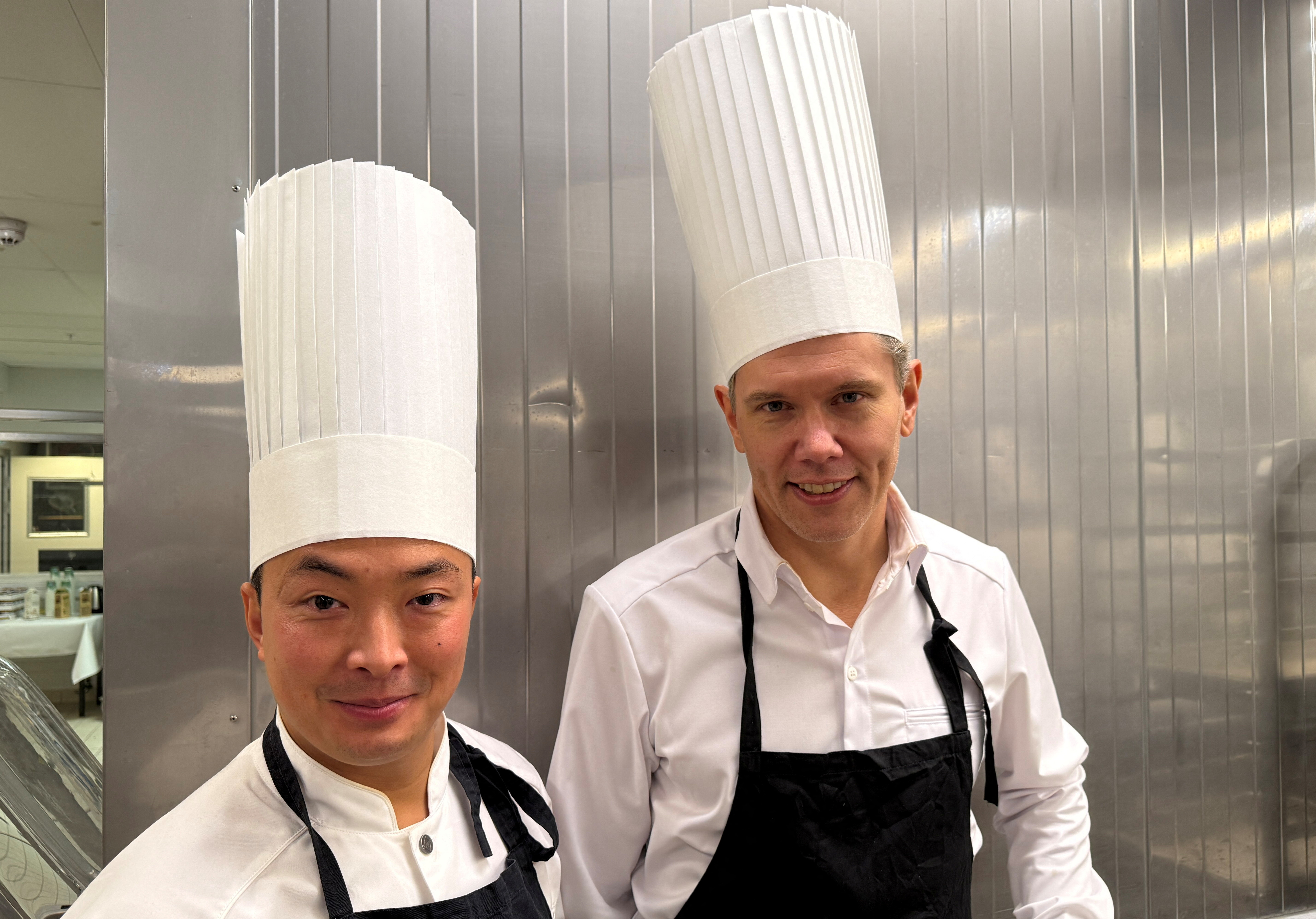 The Nobel Prize Banquet chefs Pi Le and Tommy Myllymaki, pose in the kitchen at City Hall (Stadshuset), in Stockholm