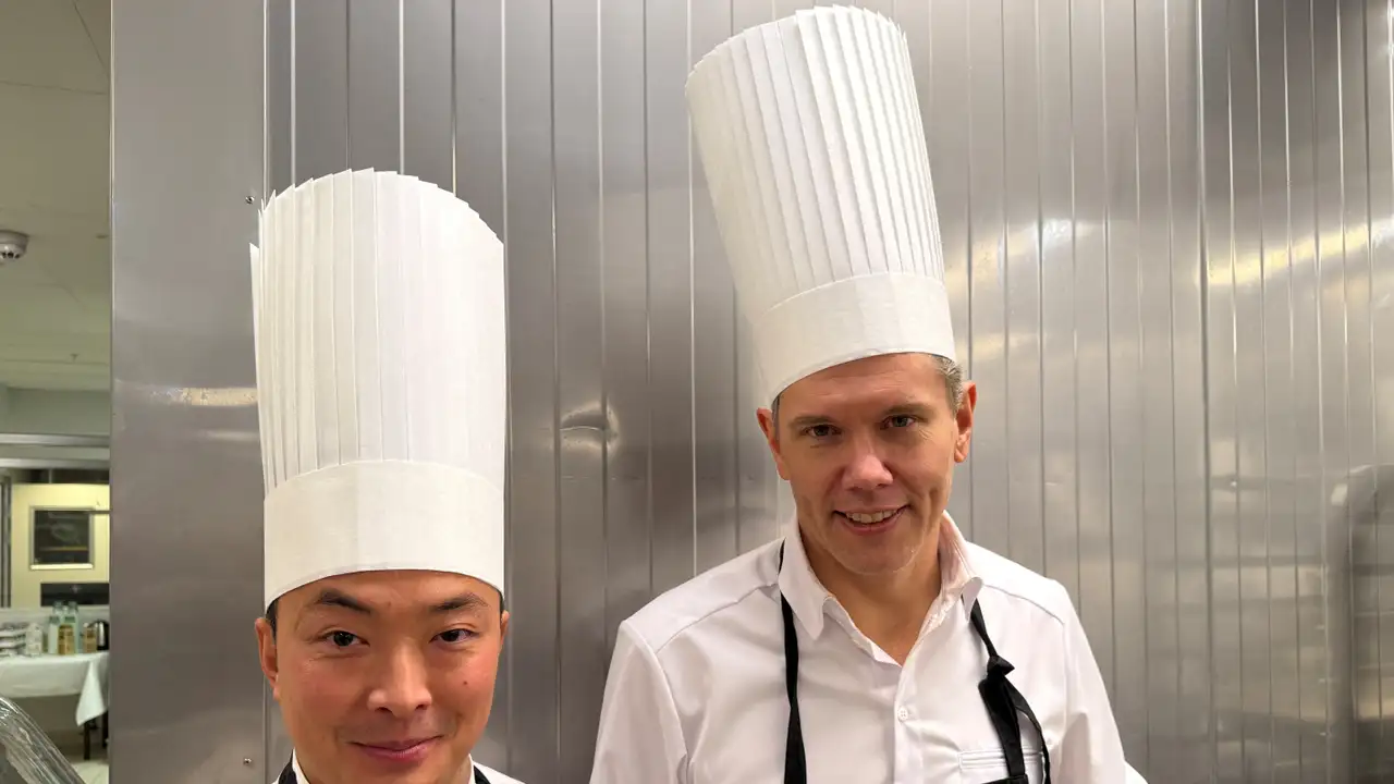The Nobel Prize Banquet chefs Pi Le and Tommy Myllymaki, pose in the kitchen at City Hall (Stadshuset), in Stockholm