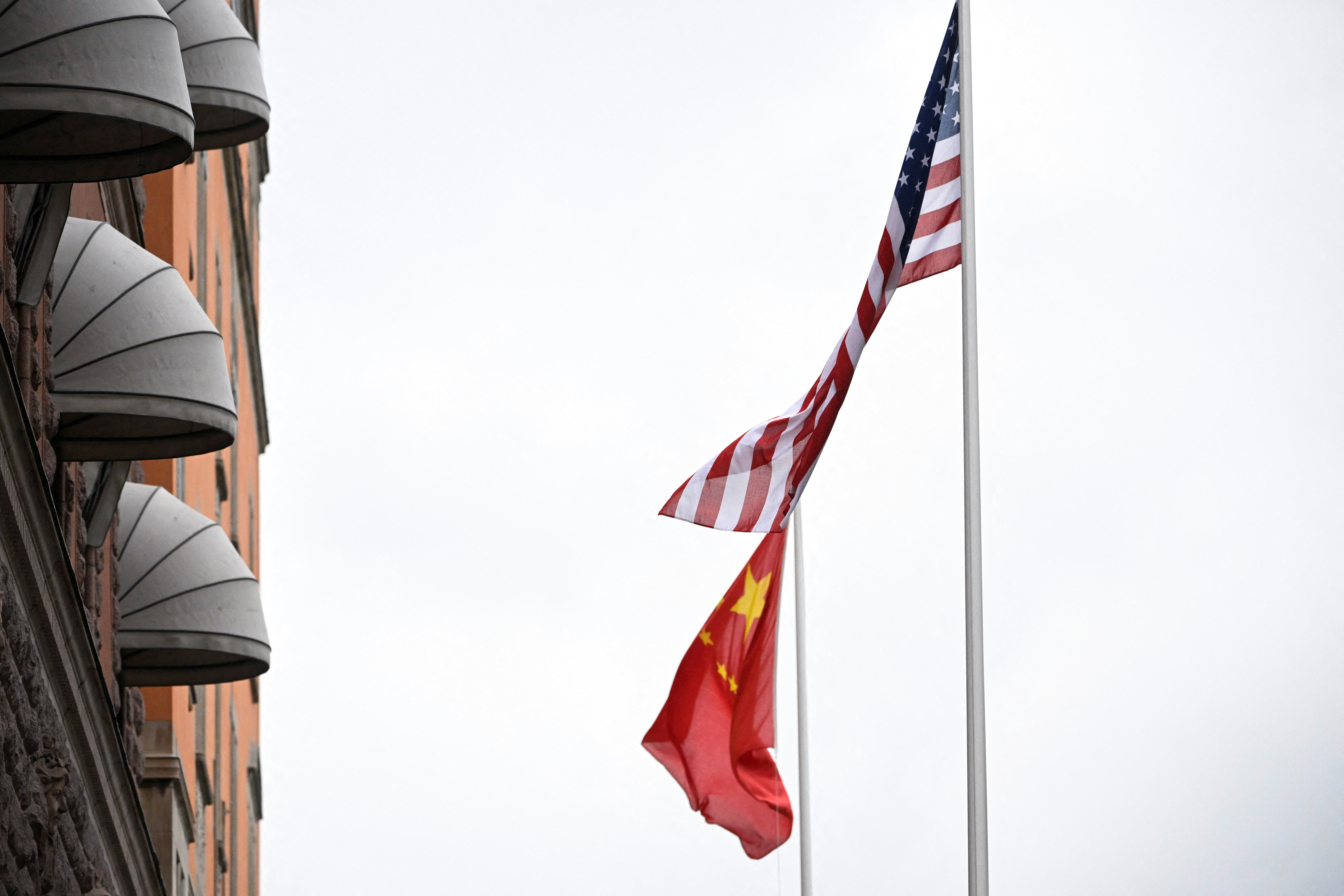 A U.S. and Chinese flag flutter outside Sweden's government offices "Rosenbad" in Stockholm