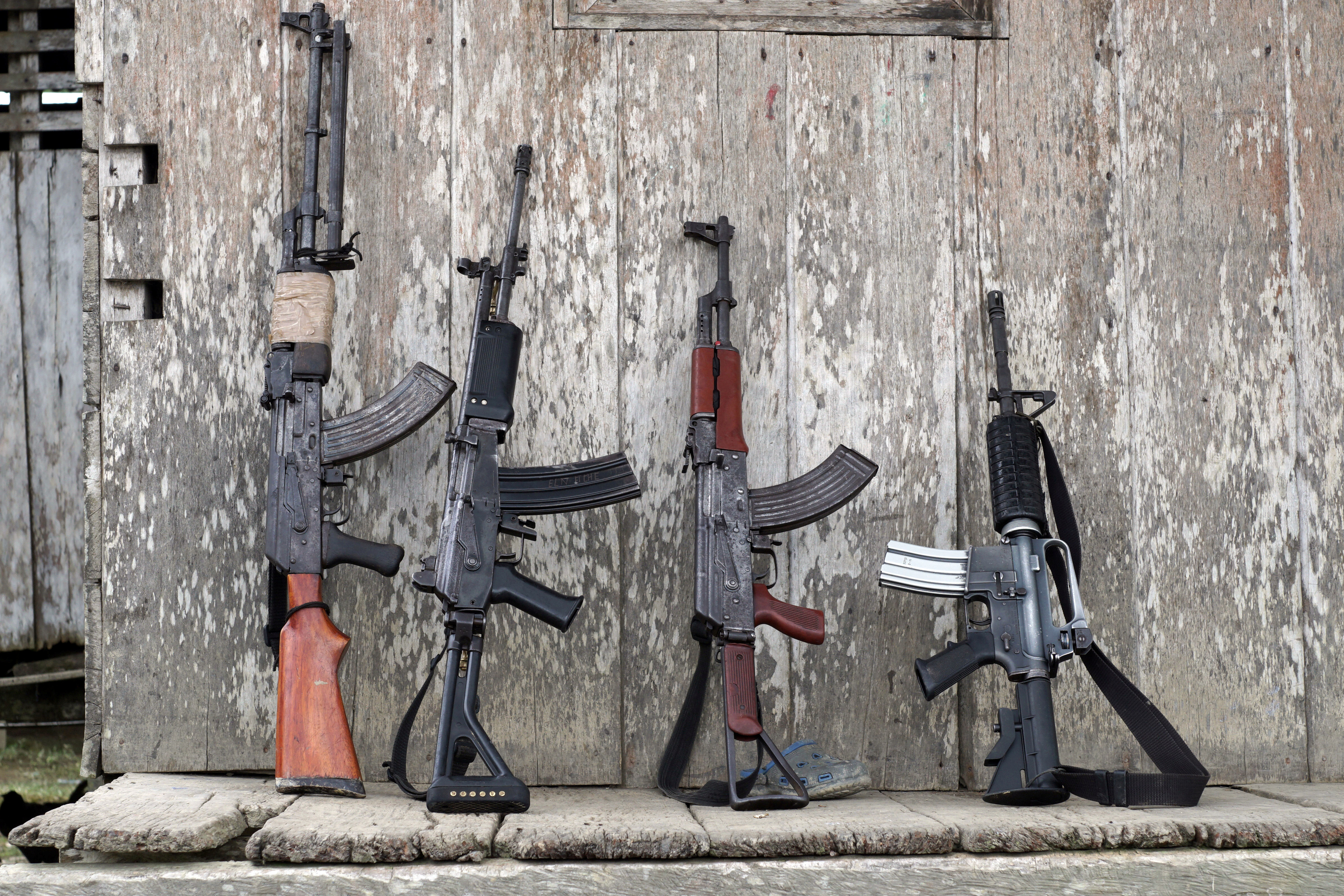 The weapons of rebels of Colombia's Marxist National Liberation Army lean against a wall of a farmer's home, in the northwestern jungles