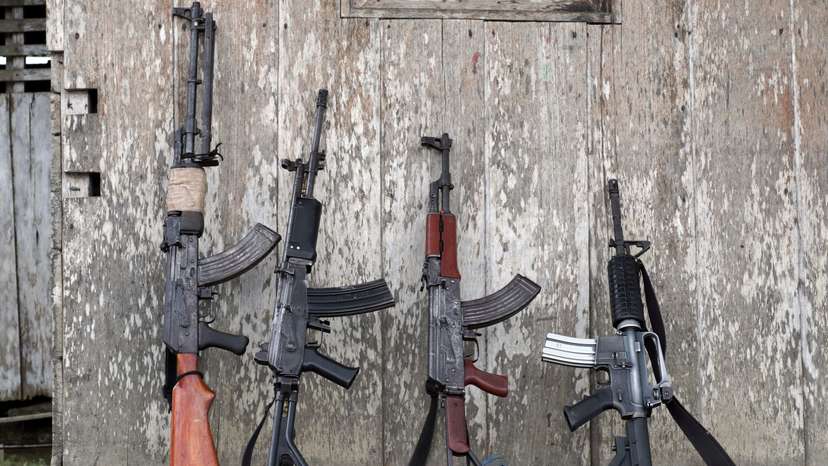 The weapons of rebels of Colombia's Marxist National Liberation Army lean against a wall of a farmer's home, in the northwestern jungles