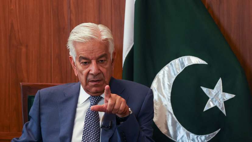 Pakistan's Defence Minister Khawaja Muhammad Asif gestures during an interview with Reuters, in Islamabad