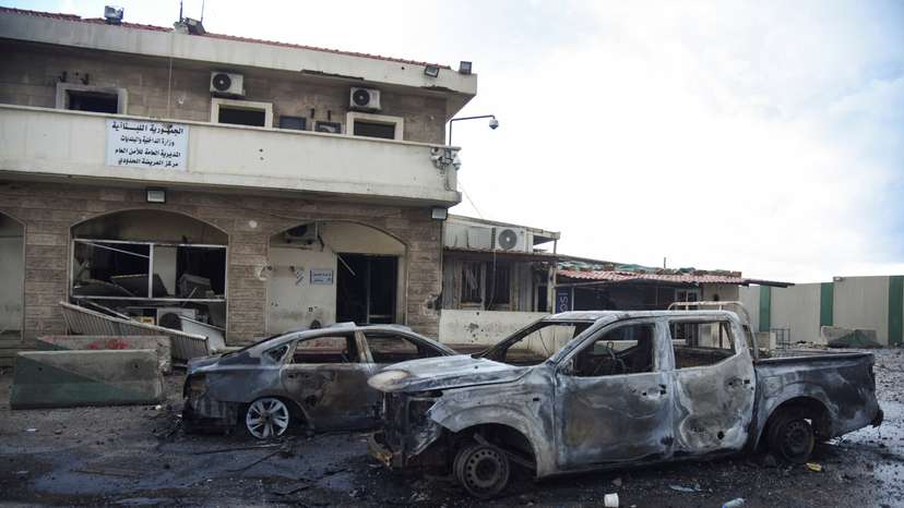 A view shows damaged cars at the Lebanese-Syrian border crossing of Arida following an Israeli strike that occurred late on Tuesday