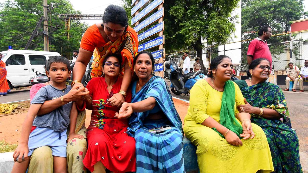 Relatives of the victims of a blast at the privately-held Escientia Advanced Sciences, mourn outside the King George Hospital mortuary in Visakhapatnam