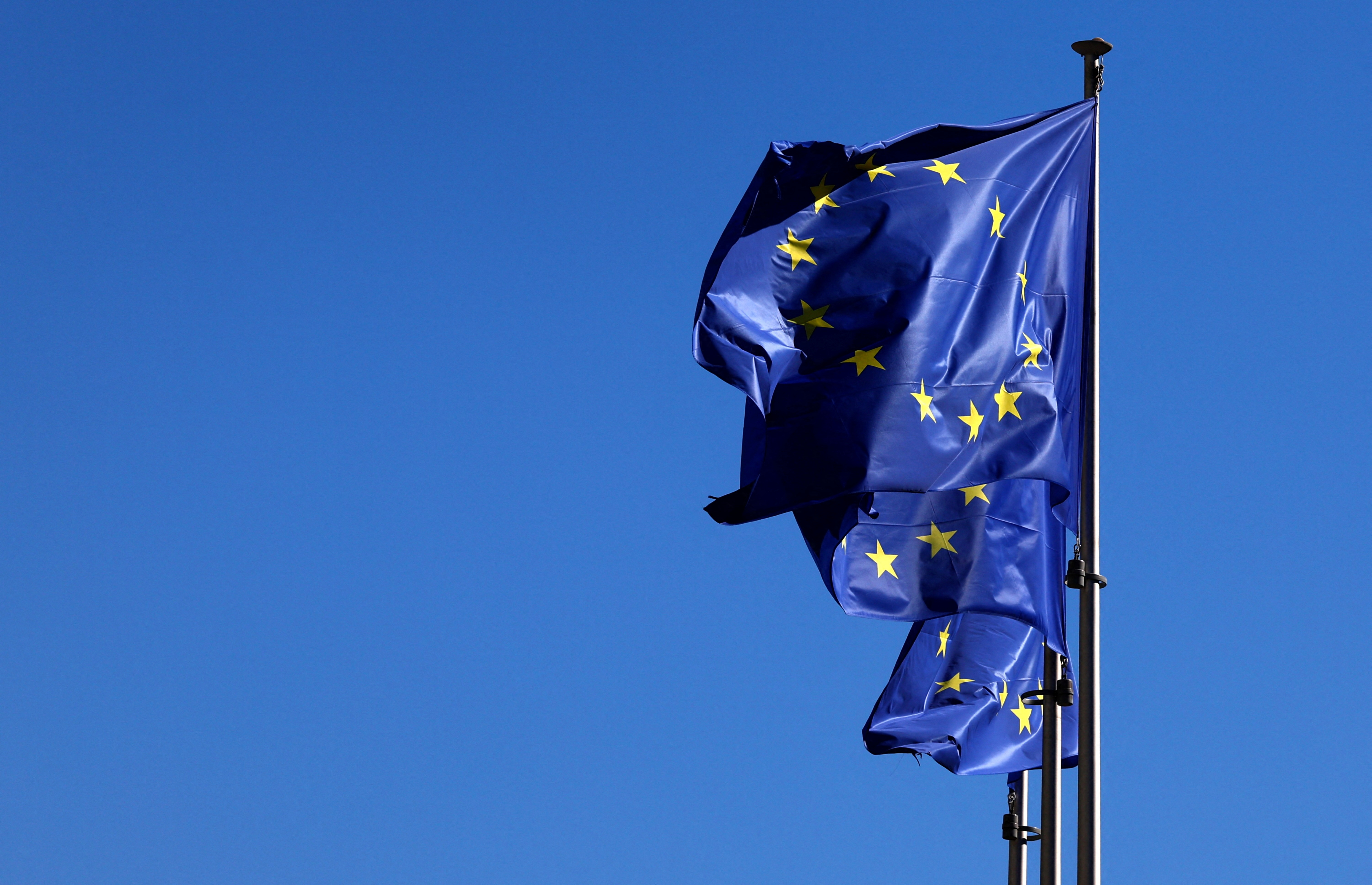 European Union flags flutter outside the EU Commission headquarters in Brussels