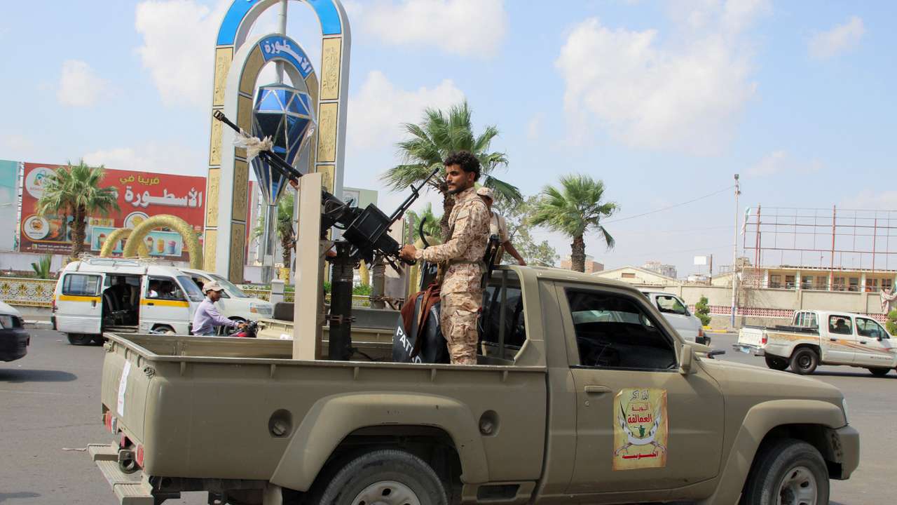 A member of the Giants Forces mans a machine gun on a patrol truck amid the southern crisis in Aden
