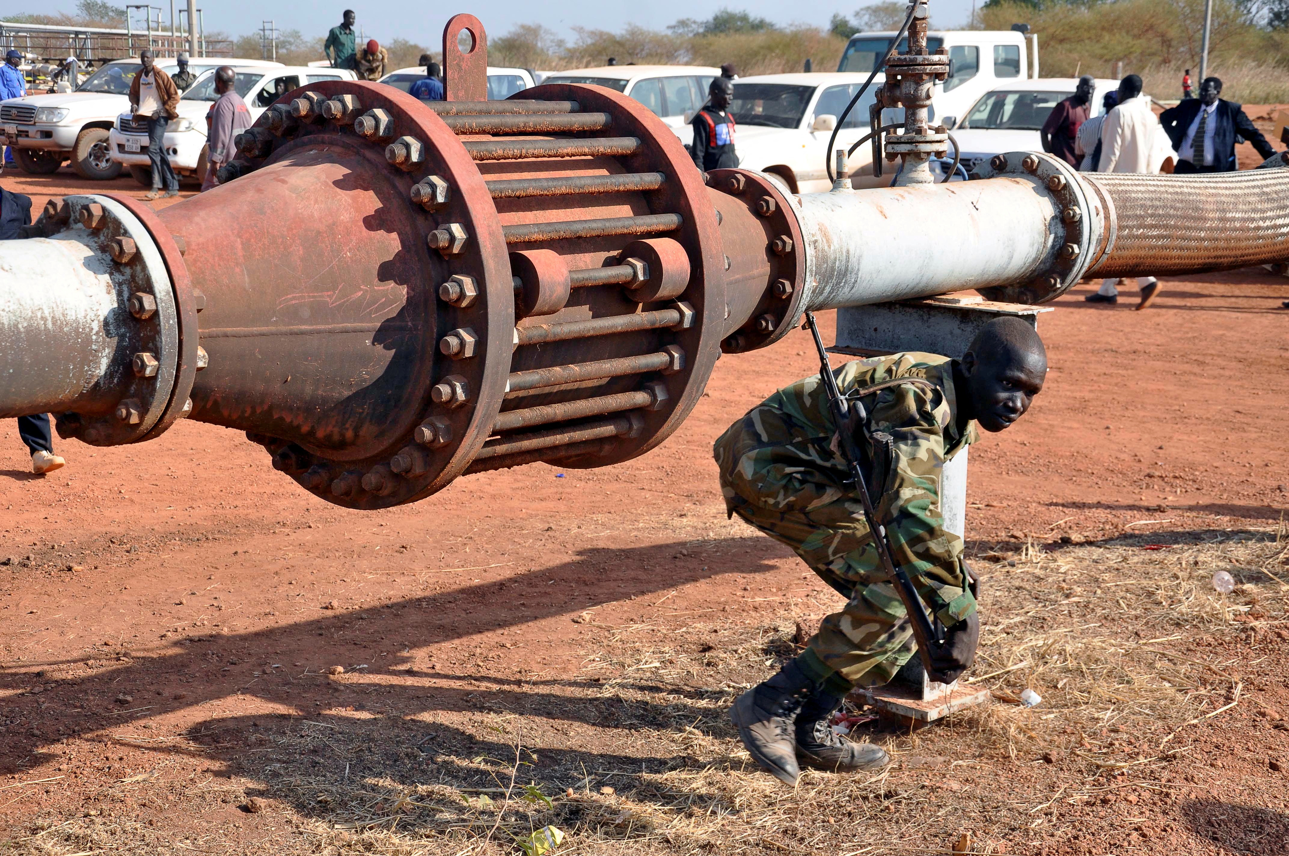 FILE PHOTO: An armed member of the South Sudanese security forces is seen during a ceremony marking the restarting of crude oil pumping at the Unity oil fields