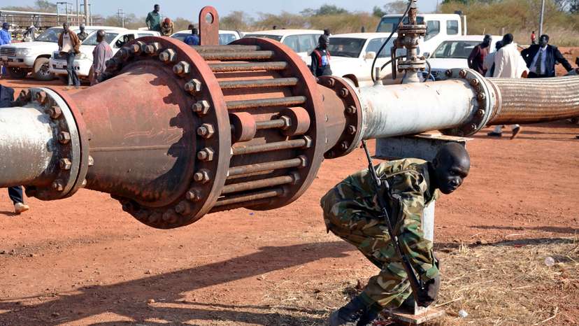 FILE PHOTO: An armed member of the South Sudanese security forces is seen during a ceremony marking the restarting of crude oil pumping at the Unity oil fields