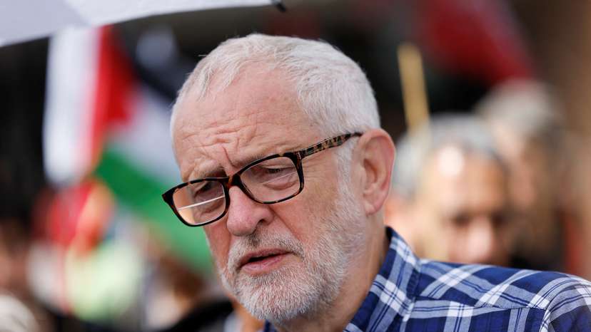People protest demanding a ceasefire in Gaza during a march, in London